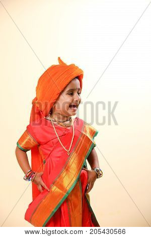 cute indian child in traditional style , posing