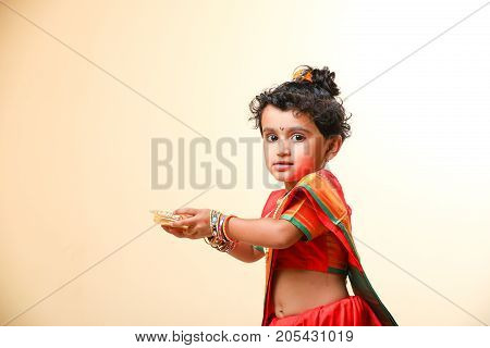 cute indian child in traditional style , posing