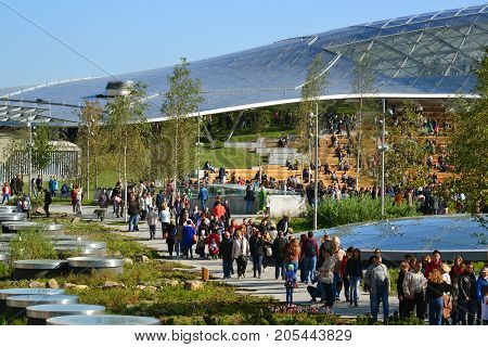 Moscow, Russia - September 23. 2017. People are walking in the park Zaryadye against the background of a glass bark.