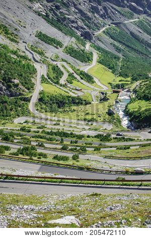 Top view of serpentine road and galleries of Stelvio Pass from above. Bormio side
