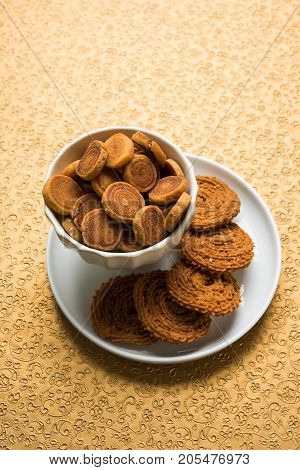 stock photo of bakarvadi and chakli or murukku, popular indian tea time snack made during festivals or diwali especially