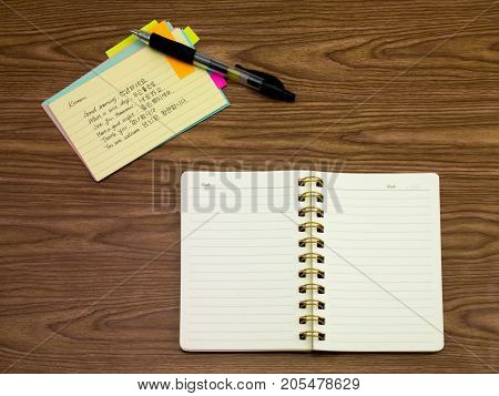 Korean; Learning New Language Writing Words On The Notebook