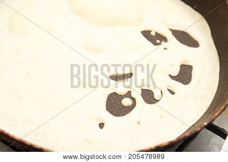 pancakes in a frying pan . Photos from the studio