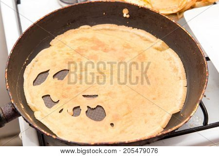 pancakes in a frying pan . Photos from the studio