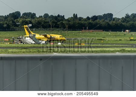 Dusseldorf, Germany - 03.09.2017: ADAC air ambulance taxi plane towards the runway to depart Dusseldorf International Airport
