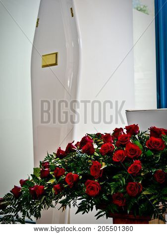 closeup shot of a colorful casket in a hearse or chapel before funeral or burial at cemetery