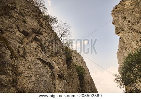 Amazing Landscape Of Rocky Mountains And Blue Sky . Sky View Between Two Rocks. Big Caucasus Mountai
