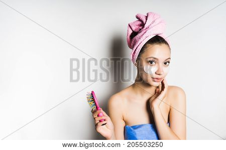 A young woman with a mask under her eyes