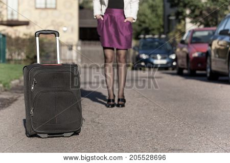 woman with travel bag on the street, getting ready for jorney.
