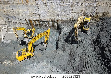 Excavators Baggers Digging At A Construction Site