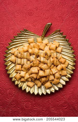 stock photo of  variety of Shakkar pare Also Know as Shakkarpare, Shakarpali, Shakkar Para, or Shankarpalli or shankar pale is a Snack Typically Made in India During Diwali