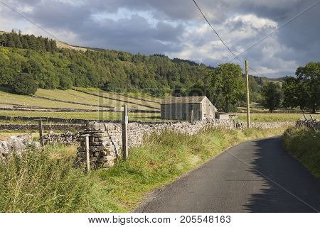 Stone field barn at the Yorkshire Dales village of Kettlewell Wharfedale England.