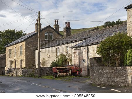 Old farm buildings Kettlewell village Yorkshire Dales National Park England.