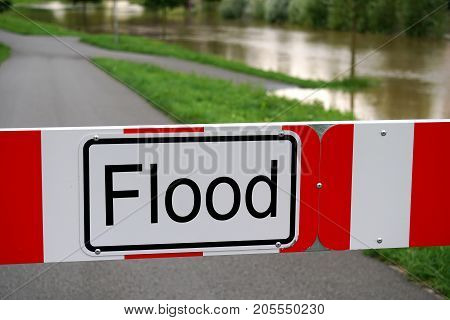 flood barrier sign, road blocked due to flooding