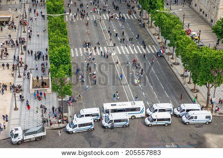 PARIS, FRANCE - JULY 2, 2017: checkpoint at entrance of Champs Elysees of French police gendarmerie, keeping security after recent terrorist attacks in Paris. View from Arc de Triomphe.