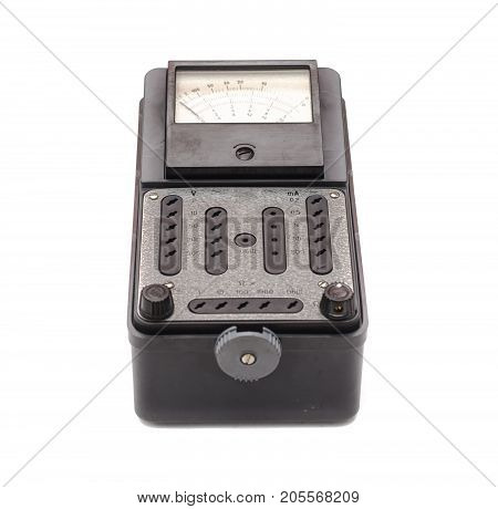 Old retro multimeter isolated on white background. Obsolete technologies.