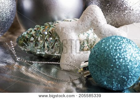 New year silver decoration on briliance background. Top view