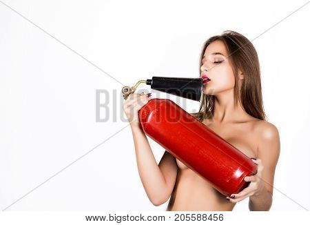 Sexy sensual female firefighter with a red fire extinguisher, with free space for your text.