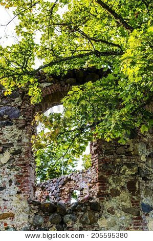 very old Kazdangas church wall of stones.