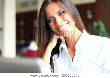Shot of an attractive mature businesswoman working on laptop