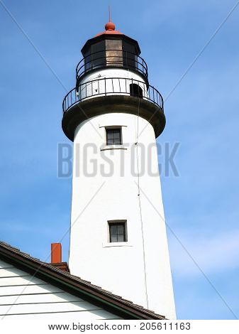 Erected in 1857 to replace the original 28 foot tower at the tip of Michigan's thumb, the 89 foot Pointe aux Barques Lighthouse is one of the oldest continuously operating lights on the Great Lakes. Its present light is an automated rotating beacon mainta