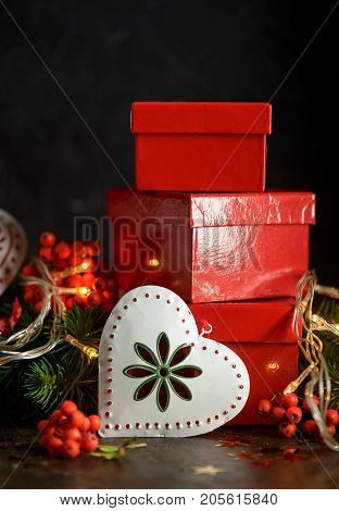 Christmas decorations with lights toys and gifts on a dark background New Year and Christmas decoration