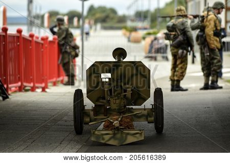 Gryfino Poland 23 september 2017: Historical reconstruction of the battle at Arnhem gun in the street soldiers in the background.