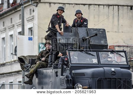 Gryfino Poland 23 september 2017: Historical reconstruction of the battle at Arnhem German soldiers riding a large military car.