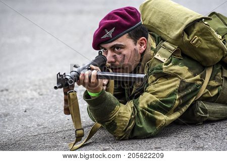 Gryfino Poland 23 september 2017: Historical reconstruction of the battle at Arnhem a British parachutist aiming with a rifle.