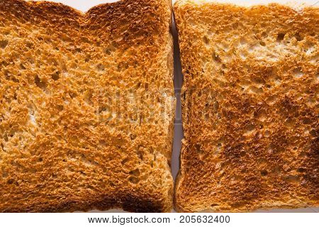 Texture of toasted white bread slices. Food background, closeup, macro