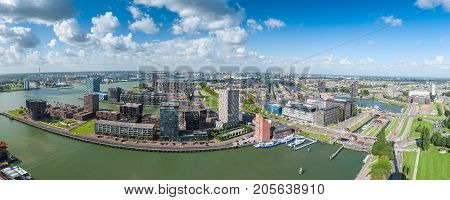 Aerial panoramic view of Rotterdam, The Netherlands, Holland. Rotterdam skyline with harbor. A major logistic and economic centre, Rotterdam is Europe's largest port and has a population of 633,471.