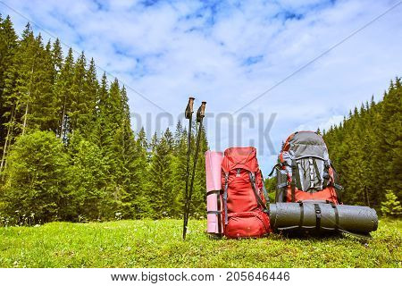 Backpacks in the mountains with views of the mountains.