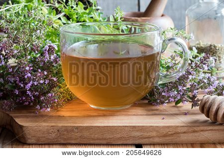 A Cup Of Breckland Thyme Tea On A Wooden Table
