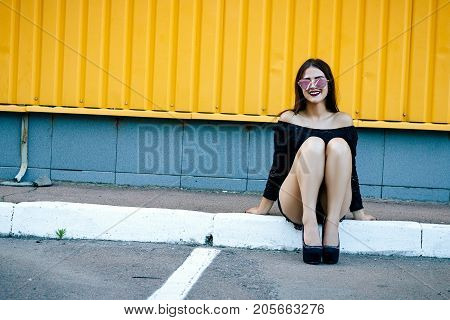 Gorgeous Brunette Girl With A Beautiful Make-up In Fashionable Clothes: A Black Blouse And Shorts Wi