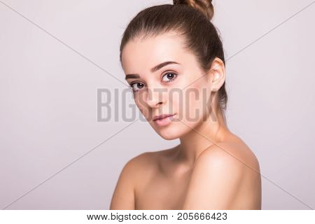 Beautiful Woman Face Close Up Hand Touching Face Studio On Gray