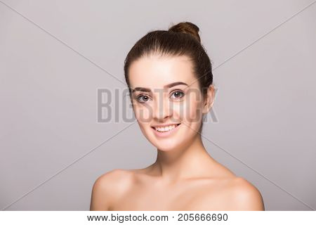 Beautiful Woman Face Close Up Hand Touching Face Studio On Gray