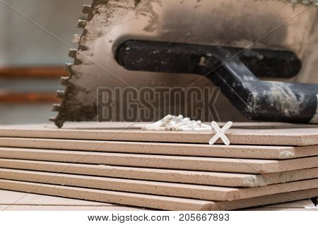 Tiling, Tile Trimming, Metering And Cutting. Repair Of The Floor. Sliced Gres Tiles.