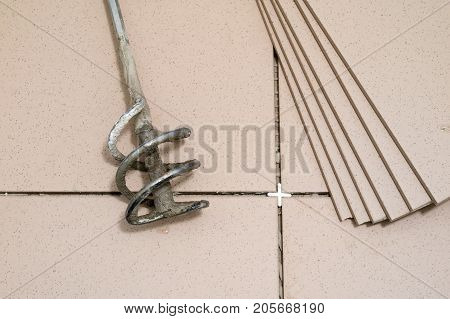 Tiling, Tile Trimming, Metering And Cutting. Repair Of The Floor. Sliced Gres Tiles.