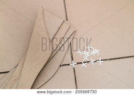 Tiling, Tile Trimming, Metering And Cutting. Repair Of The Floor. Sliced Gres Tiles.