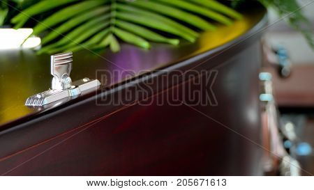 closeup shot of a colorful casket in a hearse or chapel before funeral or burial at cemetery