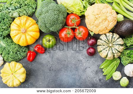 Top view of vegetables on the dark grey background, copy space for text below, selective focus