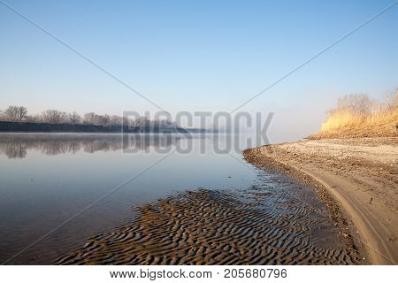 Morning on the river early morning reeds mist fog and water surface on the river