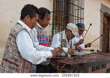 February 14 2015 Antigua Guatemala: indigenous maya men marimba band performing on the street