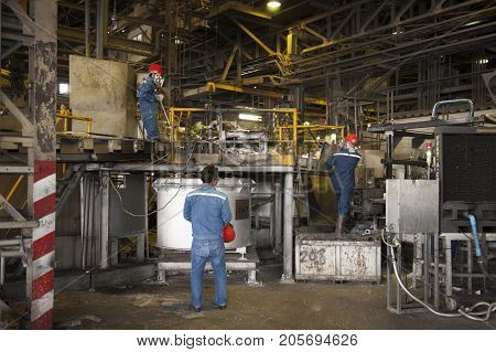Padaeng industry Mae Sot Tak Thailand February20 2013 : Zinc mine Engineer control of machine in factory.