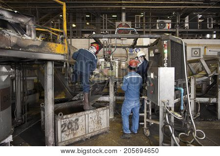 Padaeng industry Mae Sot Tak Thailand February20 2013 : Zinc mine Engineer control of machine in factory.
