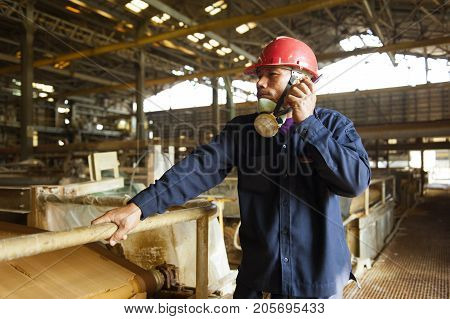 Padaeng industry Mae Sot Tak Thailand February20 2013 : Zinc mine. Engineer communicate through walkie talkie