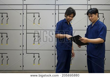 Padaeng industry Mae Sot Tak Thailand February20 2013 : Zinc mine. engineer consult about work.