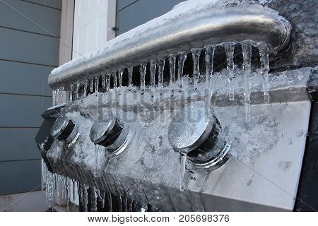 Barbecue Grill Covered in Ice in Winter