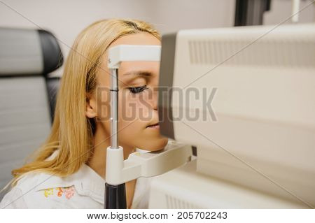 Close Up Head Of Young Patient Fix In A Non-mydriatic Retinal Camera
