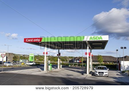 Swansea, UK: May 22, 2016: A self-service petrol station at an Asda supermarket. Asda Stores Limited is an American-owned, British-founded supermarket retailer, headquartered in Leeds, West Yorkshire.